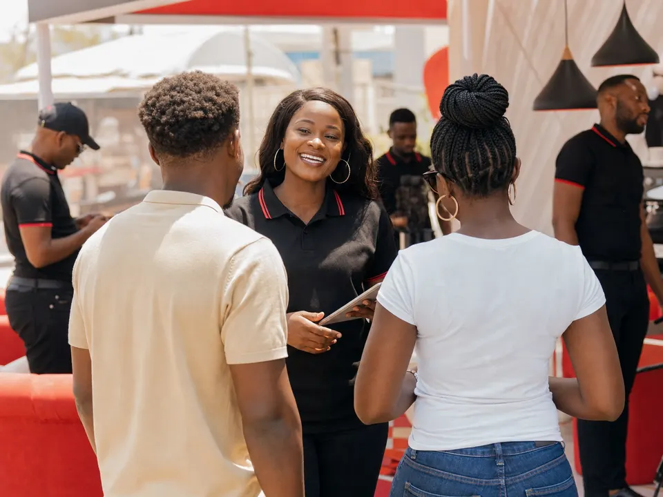 African brand professionals reviewing promotional merchandise